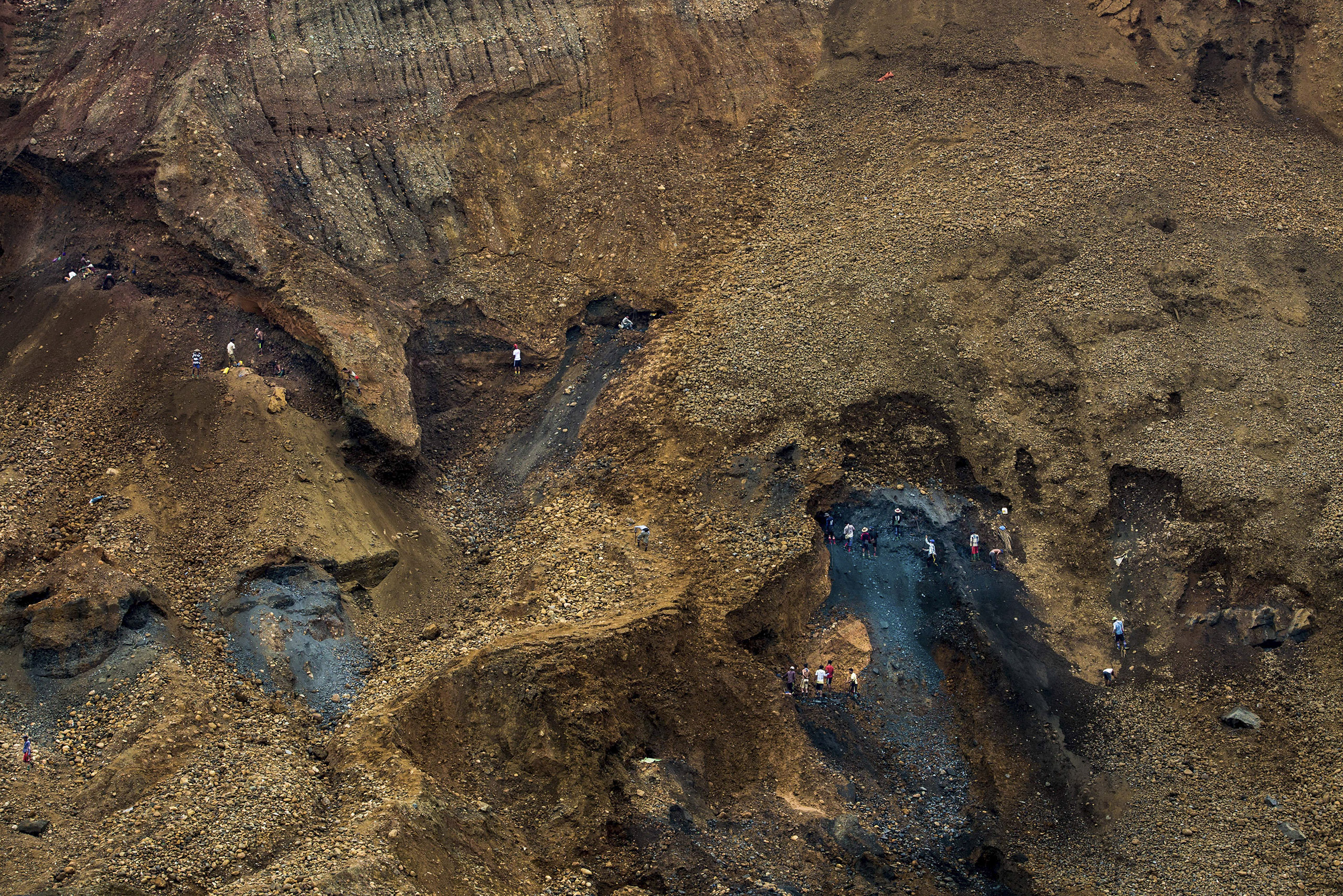 Piles of waste left over by the mines form mountainous slag heaps (Image © Hkun Lat)