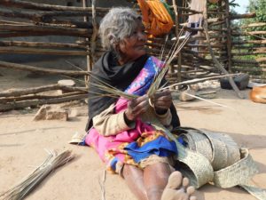 <p>Vimla, an octogenarian woman from Palamau, Jharkhand – an Adivasi majority area – weaves bamboo mats. Adivasis in the region have mastery over bamboo and cane products and sell these in markets [image by: Sushmita]</p>