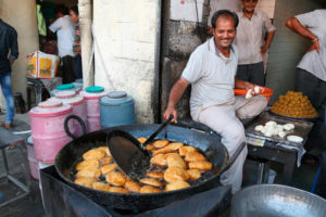<p>A street vendor deep-frying kachoris in Rajasthan, India. Cheap and versatile, palm oil is widely used for cooking in India, especially at the lower end of the market. But few Indian consumers are aware of the damage unsustainable palm oil production is doing. (Image: Alamy)</p>
