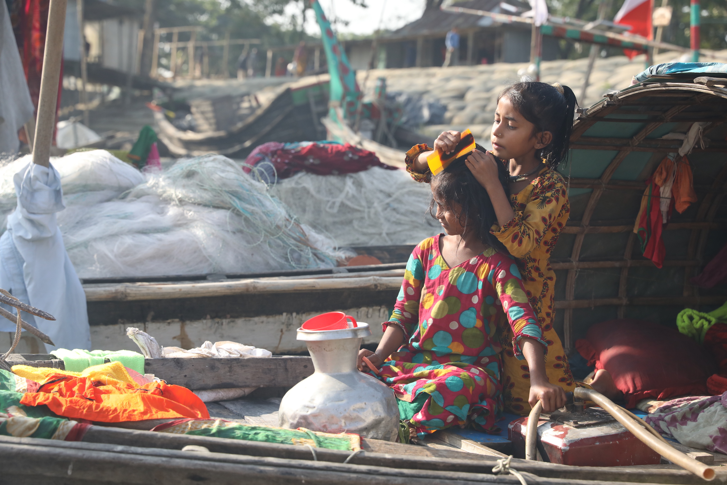 With no access to health and sanitation infrastructure, women give birth to and raise children on the boats [Image: Md. Abdus Salam]