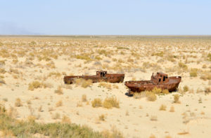 Rusting ships on dry ground which used to be the bed of the Aral Sea, in Moynaq, Uzbekistan