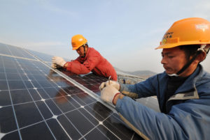 <p>Installing solar panels in Zaozhuang, Shandong province. China&#8217;s sources of renewable power are often distant from areas of high demand, making large-scale integration a challenge (Image: Alamy)</p>