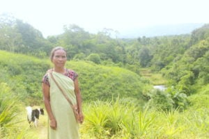 Thrias Makroh cultivates pineapples at her land on the slope of a hill. (Image: Varsha Torgalkar)