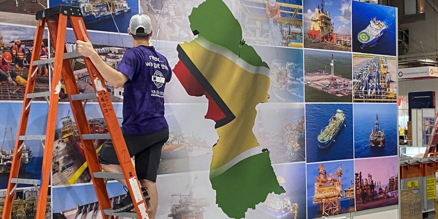 A worker sets up an exhibition stand in Guyana. 