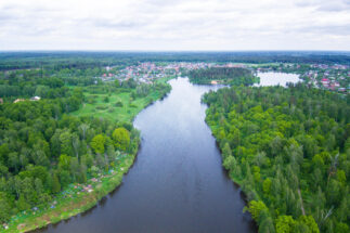 aerial shot of a body of water surrounded by green vegetation