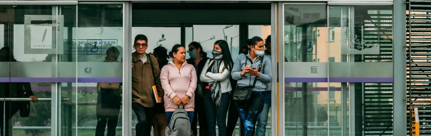 people waiting on a platform