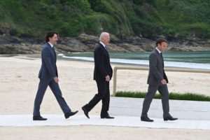 Justin Trudeau, Joe Biden and Emmanuel Macron walking