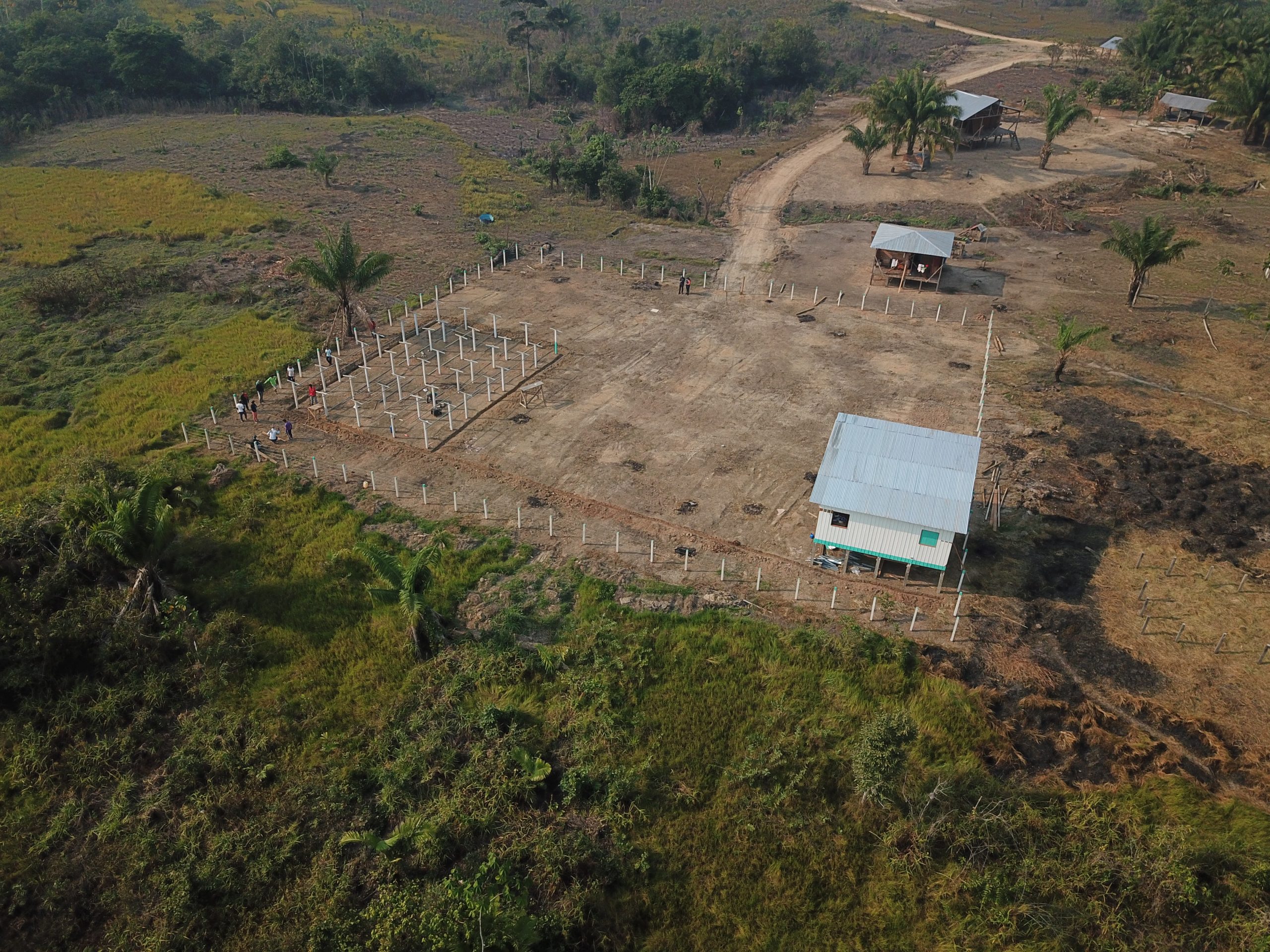 An aerial view of a small-scale solar plant under construction
