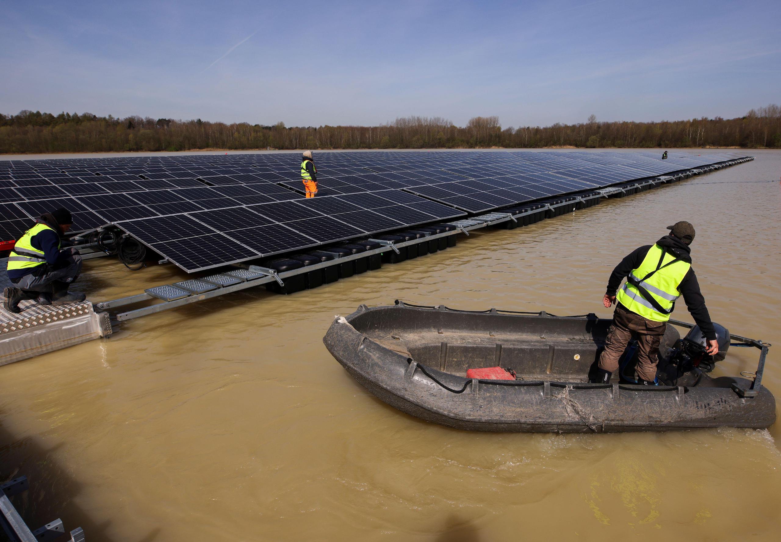 <p>Floating solar panels are installed on Lake Silbersee, Germany, earlier this year. Floating solar has been deployed in Europe and east Asia for <a href="https://dialogue.earth/en/energy/floating-solar-ready-for-take-off/">nearly a decade</a>, and interest is now growing in India as the country scrambles to meet its renewable energy targets. (Image: Thilo Schmuelgen / Alamy)</p>