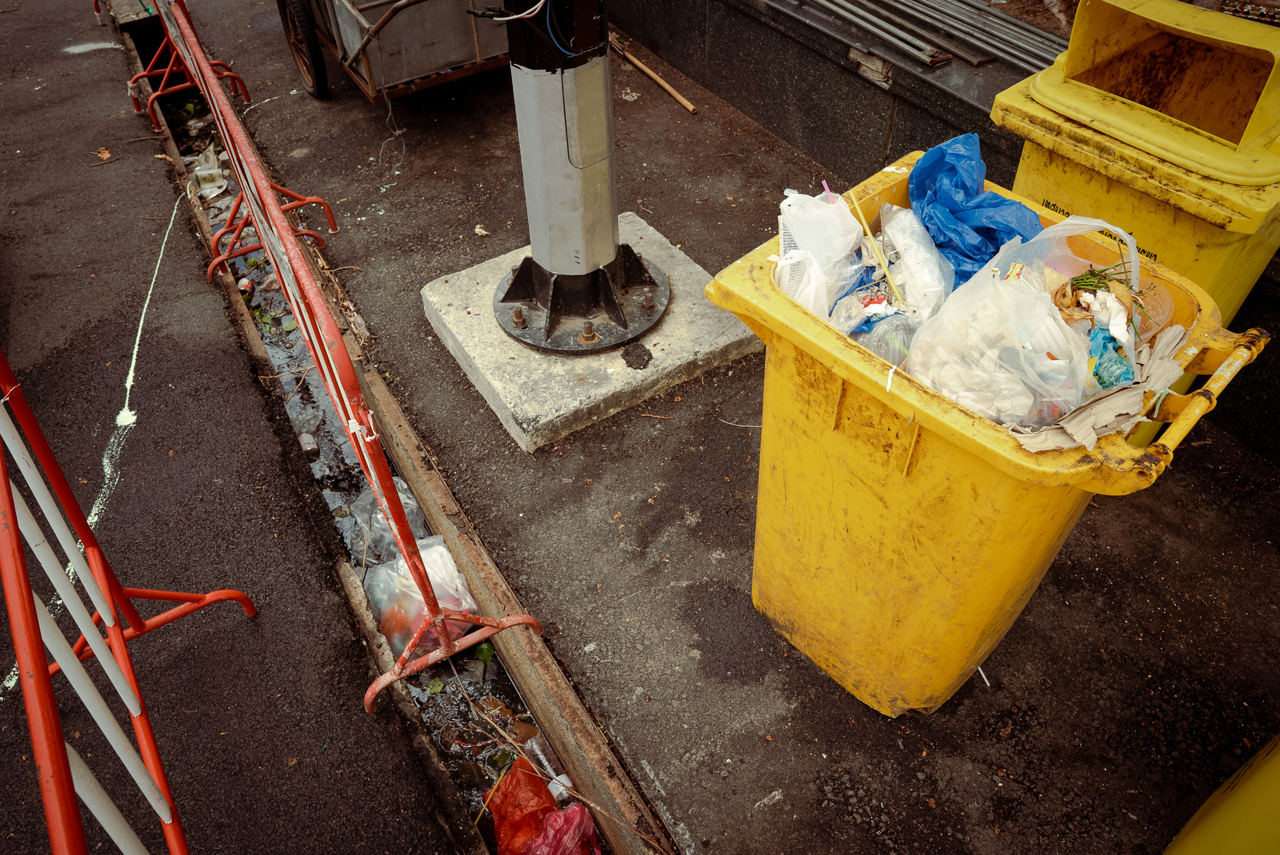 overflowing yellow bin
