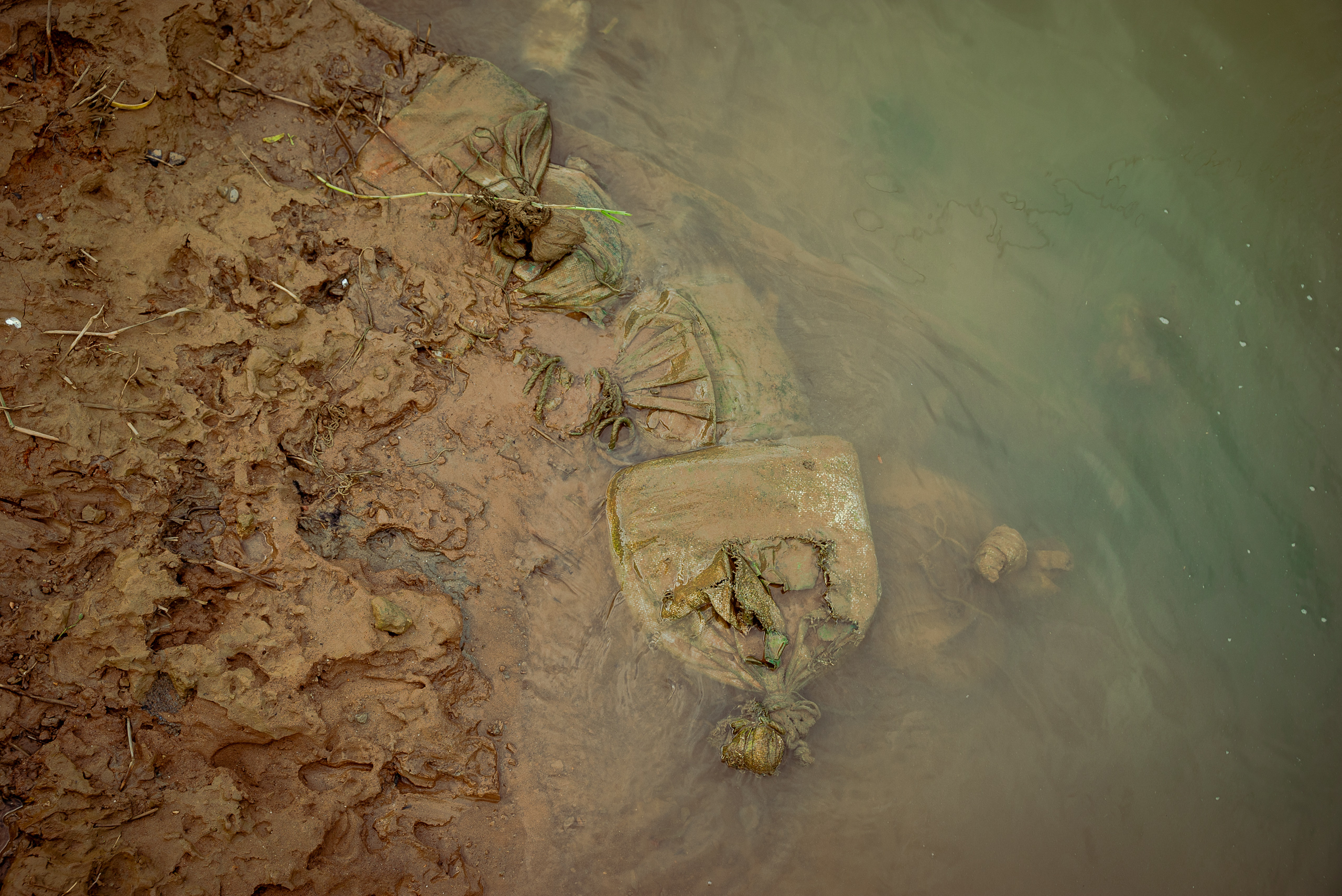 sandbags in shallow part of river