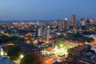 <p>The capital city of Asunción at night. Paraguay generates enough electricity through three hydropower dams to cover domestic demand, but several factors contribute to problems in ensuring supply. (Image: <span id="automationNormalName">Guido Schiefer</span> / Alamy)</p>