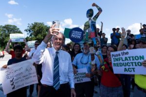 Senator Ed Markey takes a selfie video with climate activists at the Senate steps after the Senate passed the Inflation Reduction Act in the Capitol