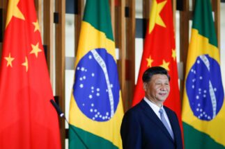 Xi Jinping at an event in front of the Brazilian flag