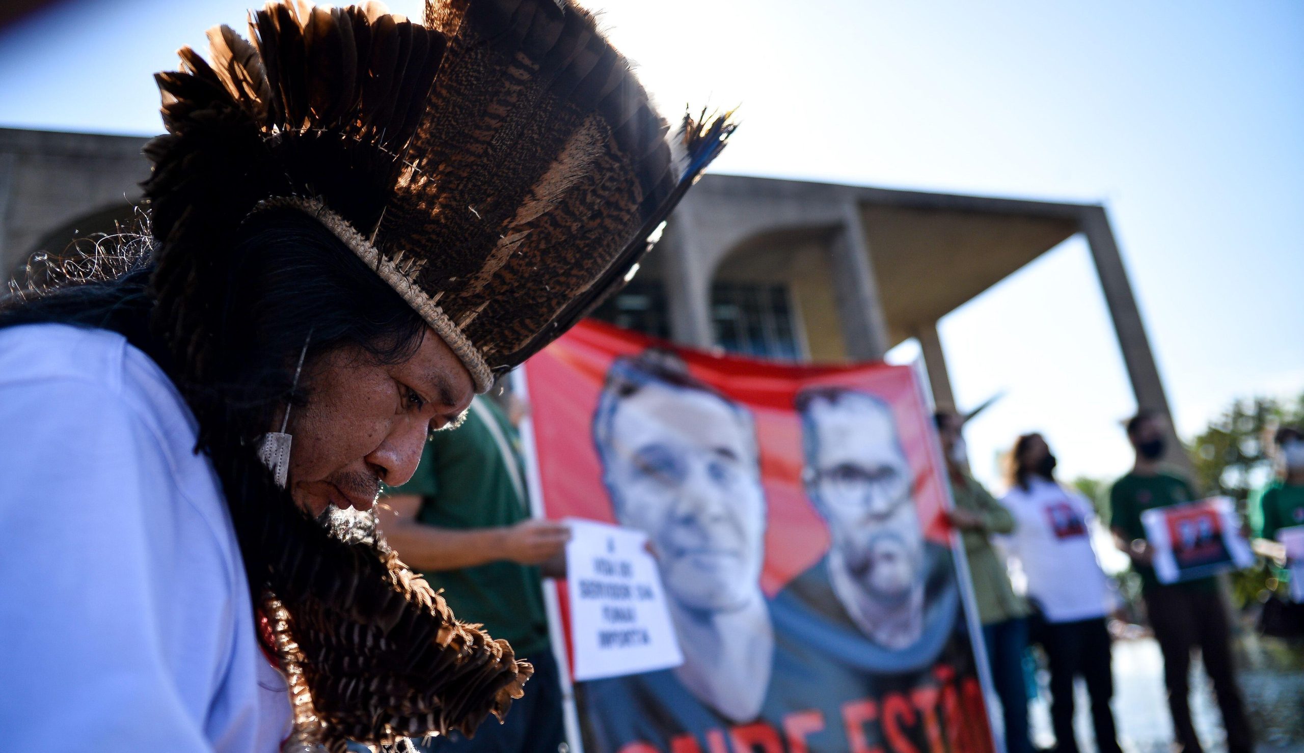 An Indigenous protestor demonstrates outside Brazil’s Ministry of Justice