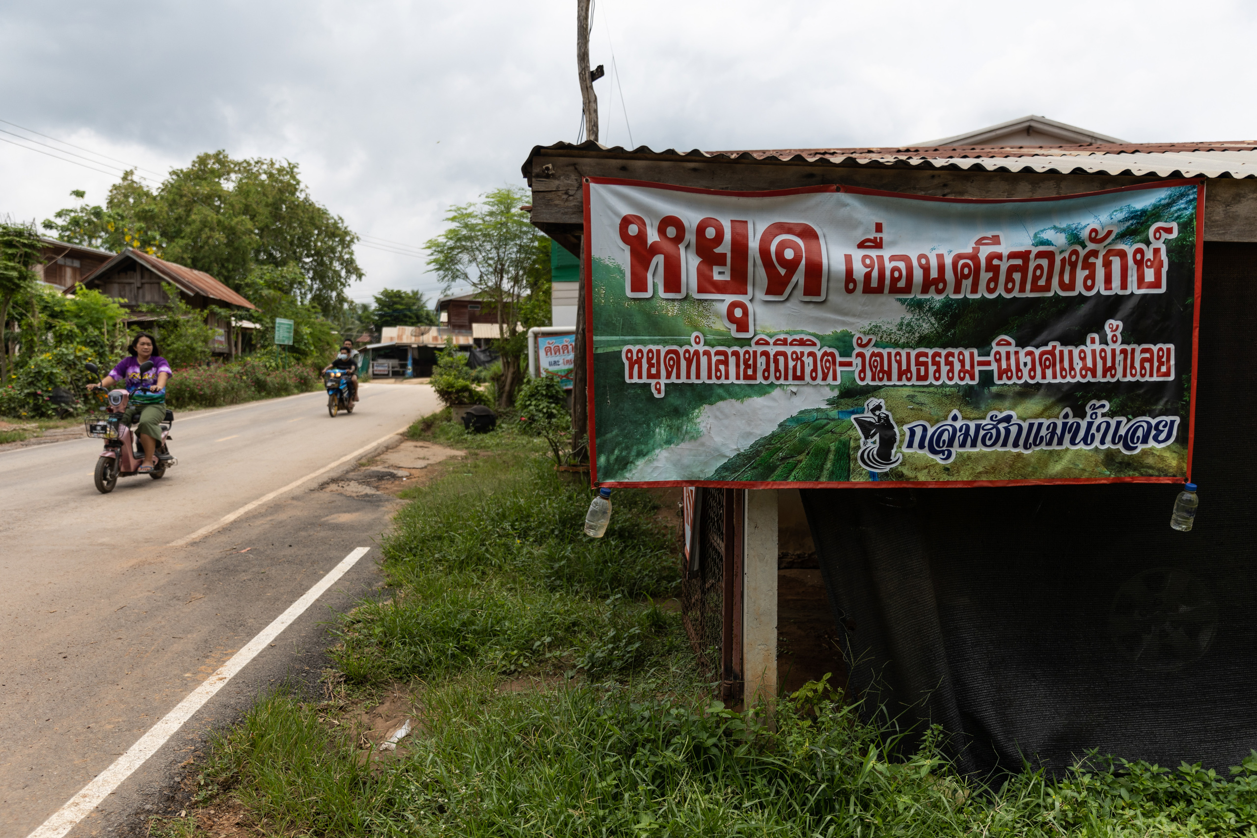 An anti-dam banner hangs at a house in Ban Klang village