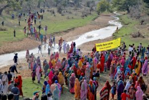 villagers walk towards the Mahan forest during a protest against a coal mining project in Madhya Pradesh