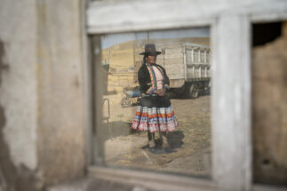 A reflection of a woman from a community on Peru's mining corridor