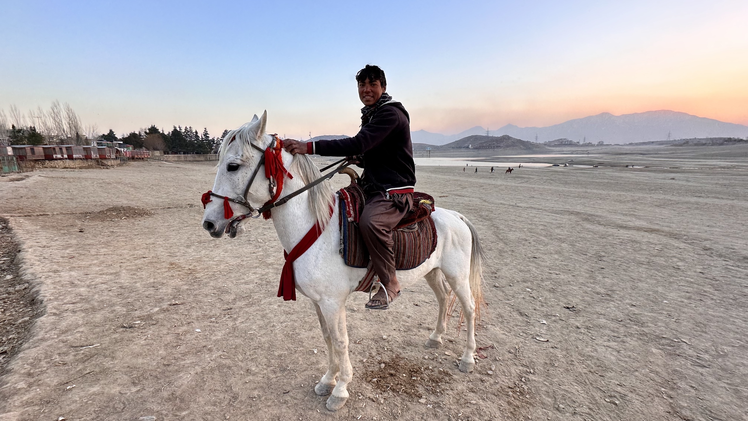 A man running horse rides business near Qargha Lake