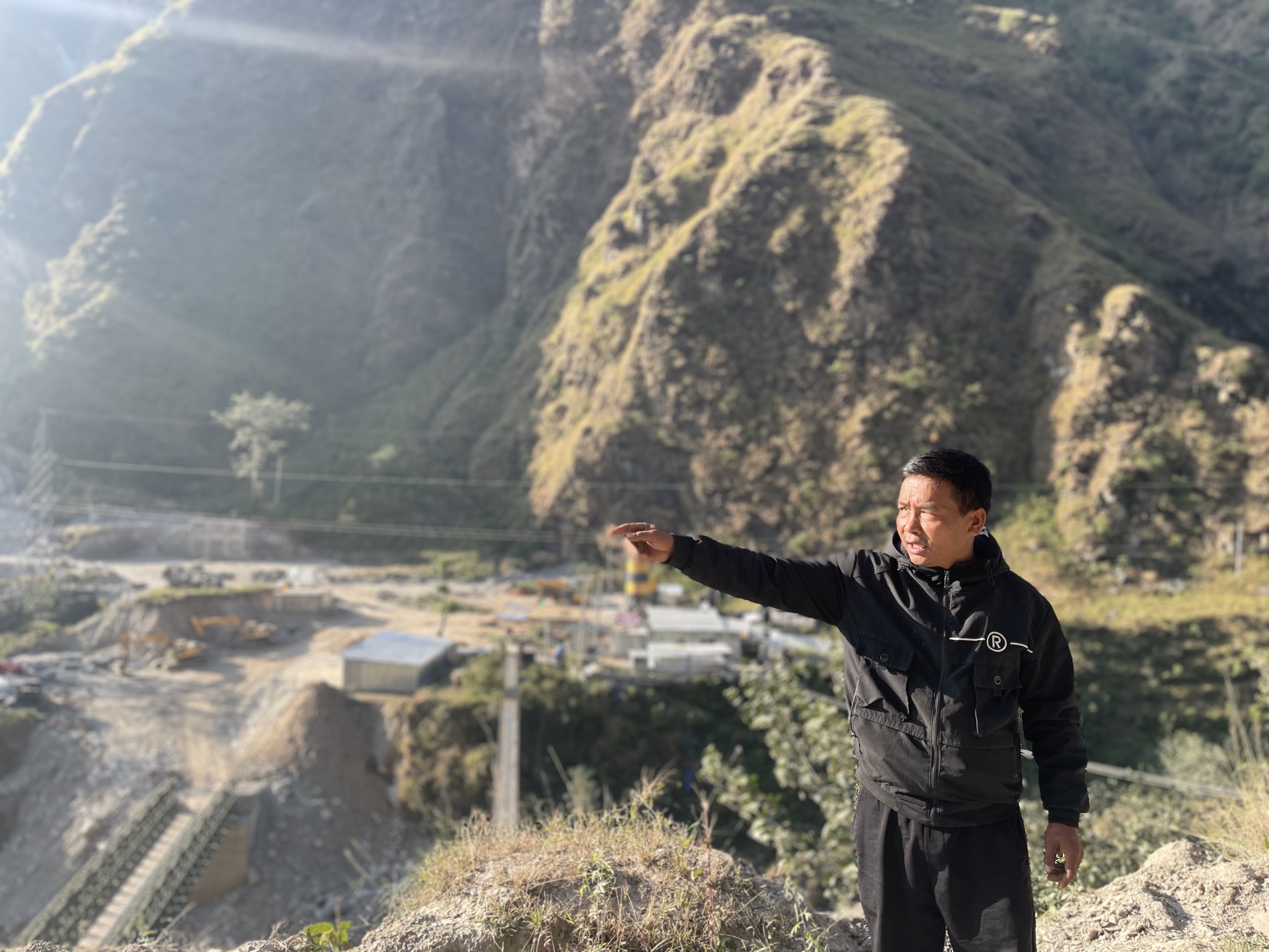 A villager explains the environmental problems in the area 