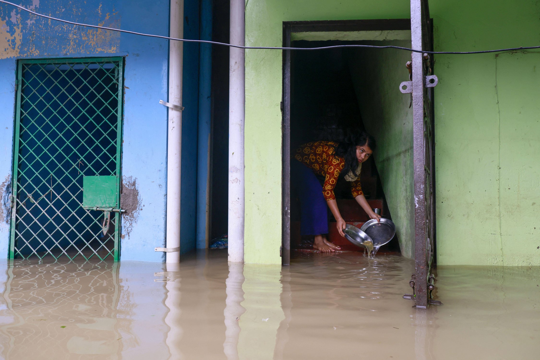 Flooding in the district of Sylhet, Bangladesh, in June 2022. Urban flooding after heavy rainfall is common, as conventional drains can quickly become clogged with silt. Image: Suvra Kanti Das