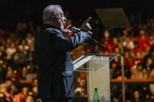 Brazilian President Lula at his final campaign event in September 2022, in front of a crowd giving a speech