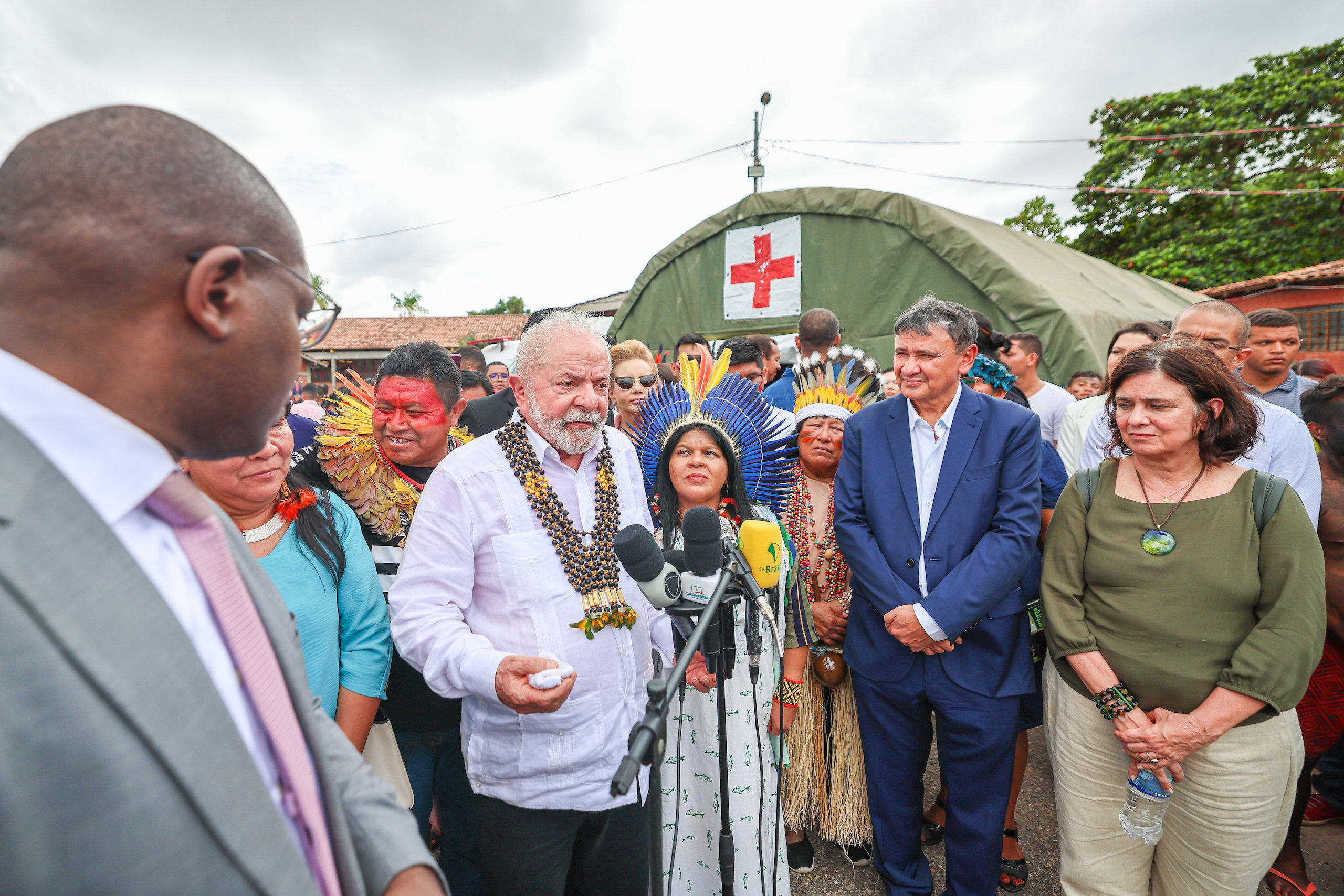 Brazil president Lula stands in a group of people including Indigenous leaders and politicians