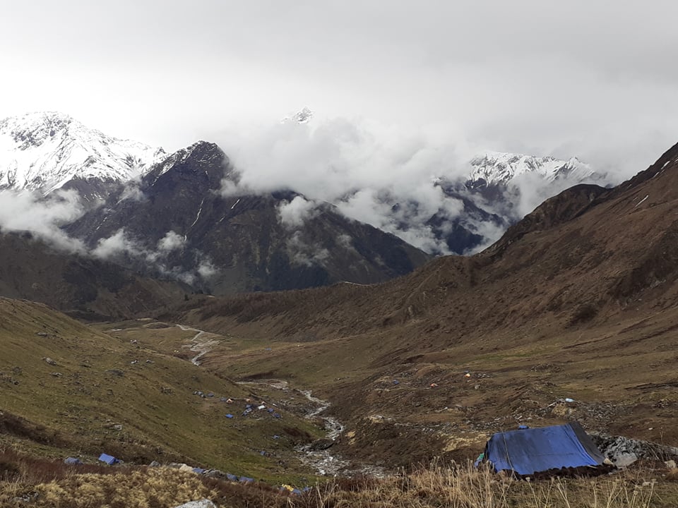 snow capped mountains on cloudy day