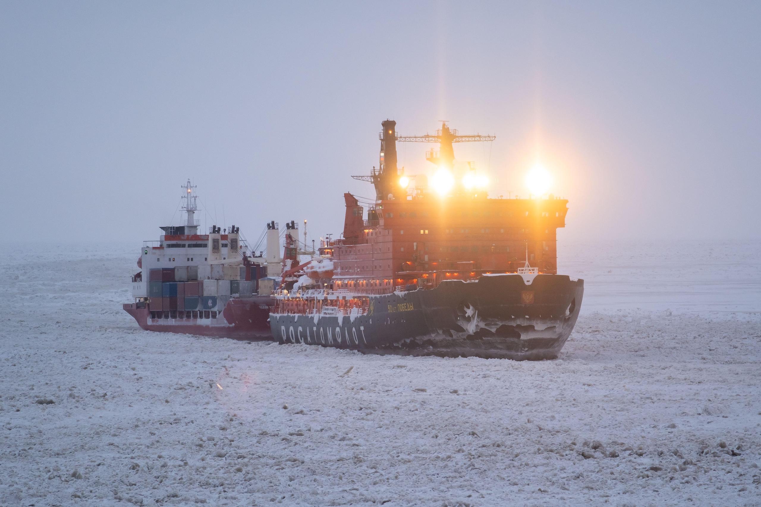 An icebreaker tows a cargo ship through ice close to the Yamal liquified natural gas plant on Russia’s arctic coastline. 