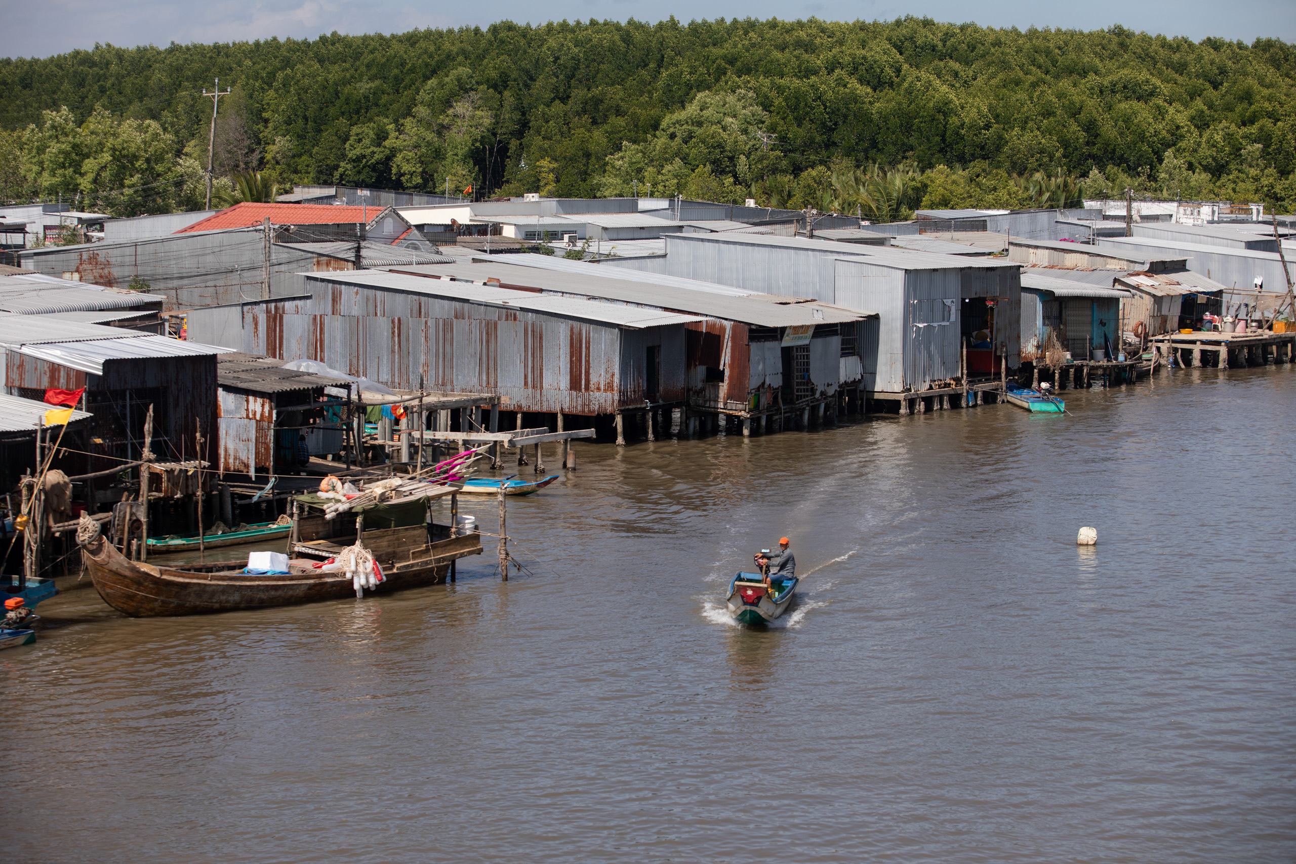 Traffic in a canal on the fringe of the Ca Mau Cape National Park.