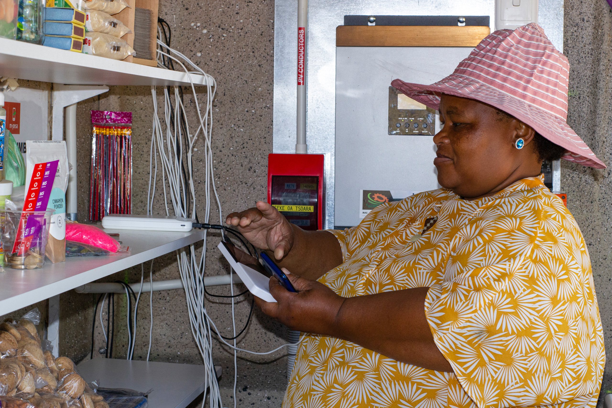 a woman charging phones and power banks