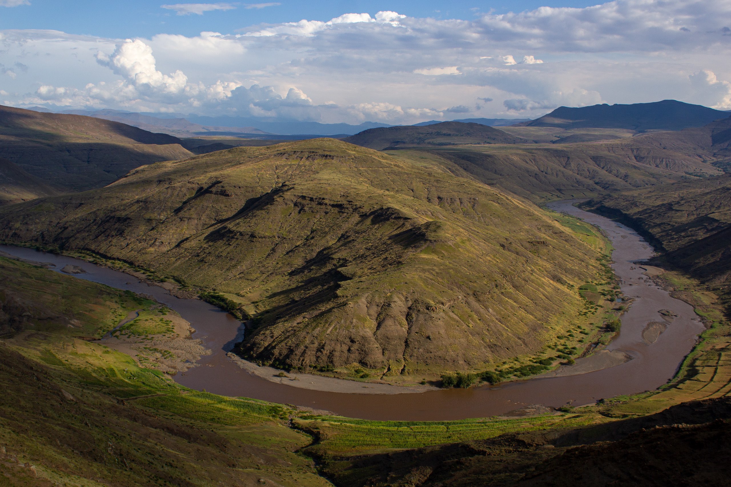 Senqu River running through a lush green valley.