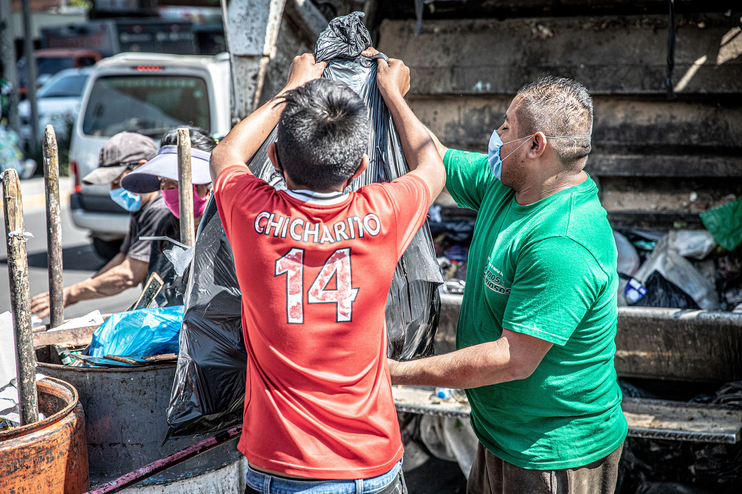 Recycling workers sorting plastic waste in Mexico City