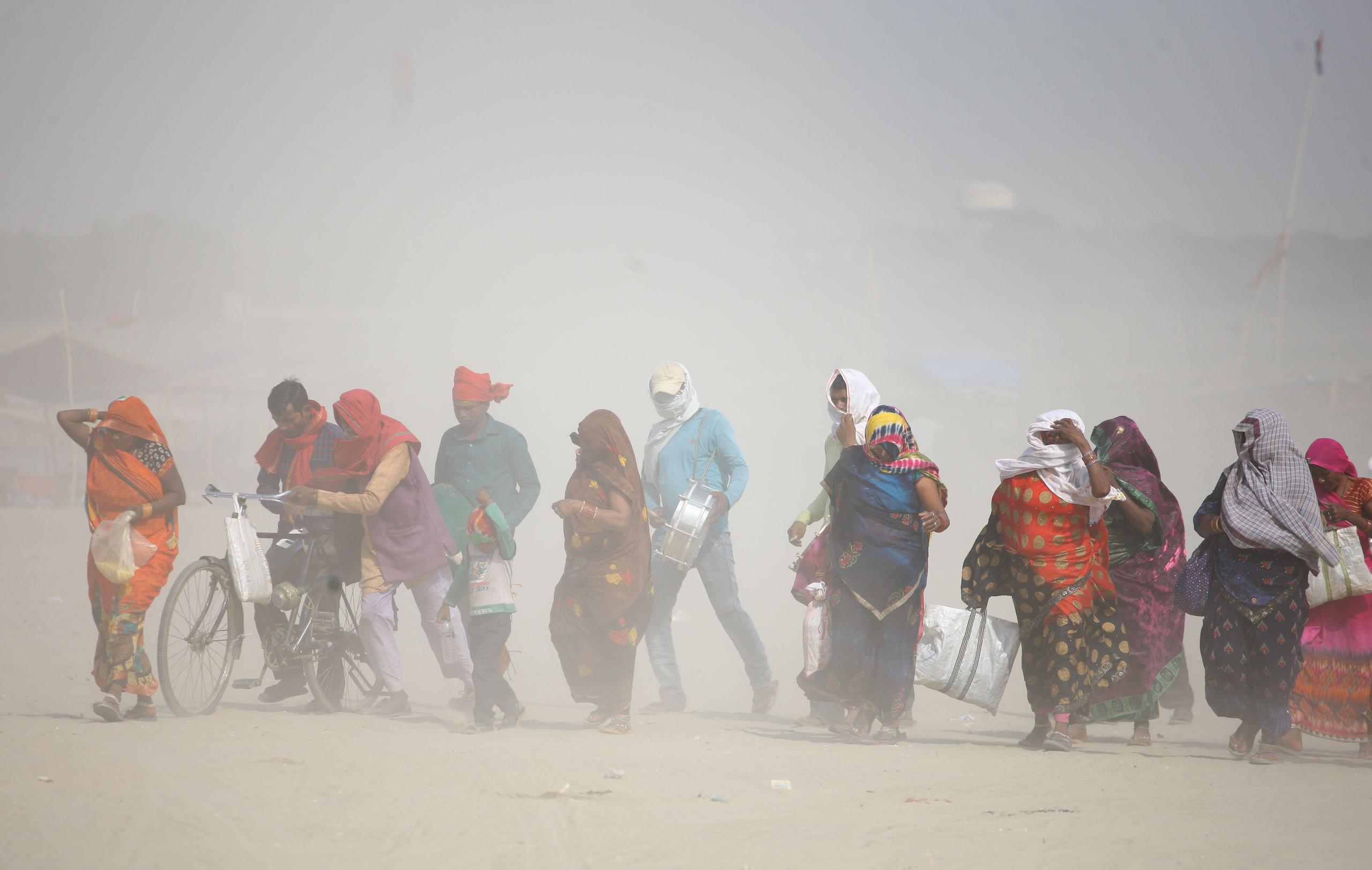 <p>Workers commute during heatwave conditions in Prayagraj, in India’s Uttar Pradesh state, on 7 June 2022. This year, the state has suffered extreme heat once again. (Image: Ritesh Shukla / Alamy)</p>