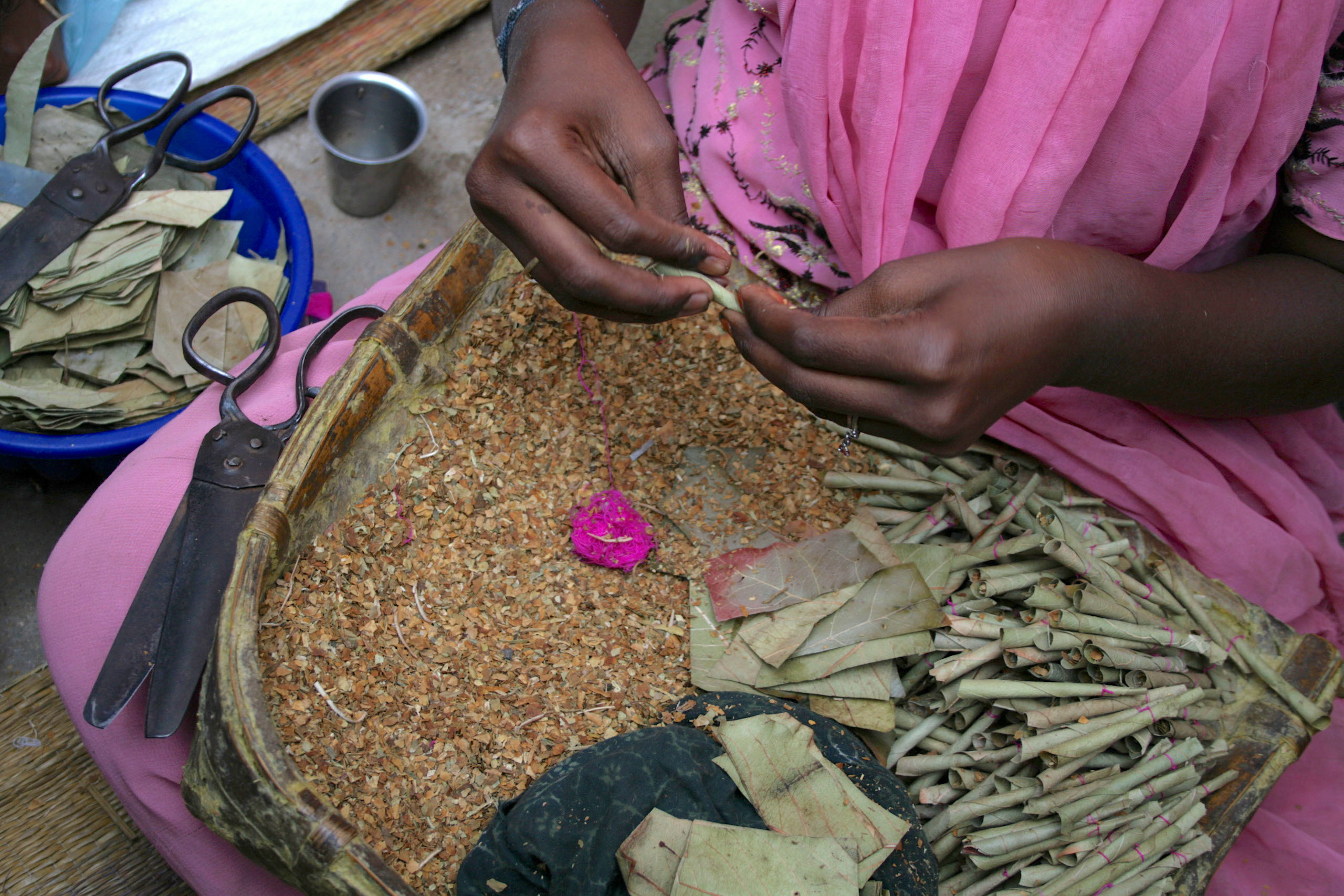 A woman rolling beedi cigarettes