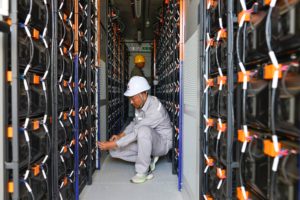 <p>Batteries store electricity generated at a solar farm in Erdos, Inner Mongolia. The region is currently conducting a trial of power spot-trading. (Image: Wang Zheng / Alamy)</p>