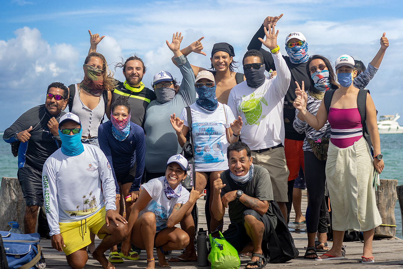 group of people posing for camera