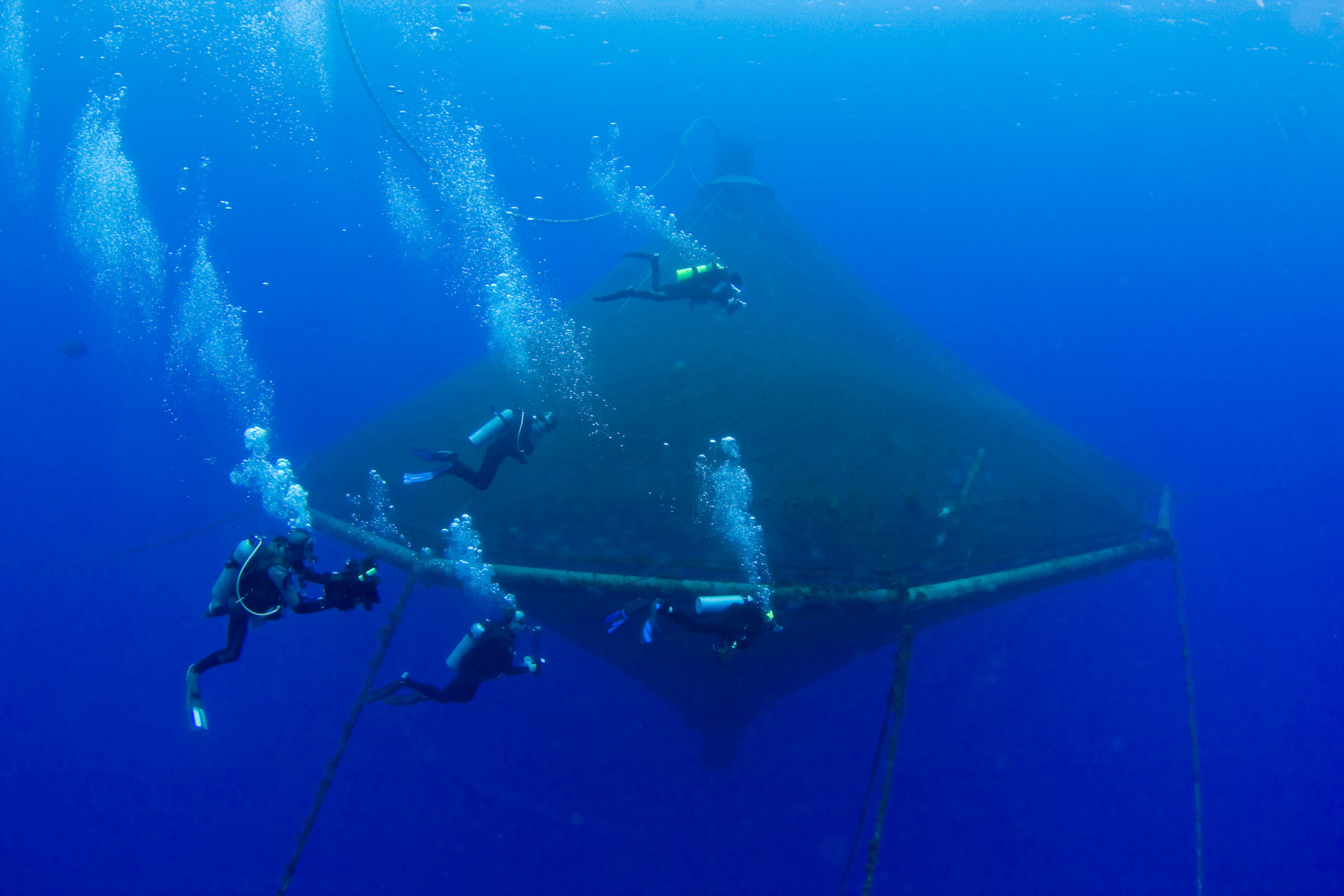 a group of divers in gear underwater