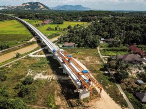 <p>The East Coast Rail Line, peninsular Malaysia, April 2023. The <a href="https://dialogue.earth/en/business/11842-photo-journey-malaysia-s-new-china-funded-railway/">line</a> is planned to link up to a wider pan-Asian network of railways currently under construction or planned as part of the Belt and Road Initiative. (Image: Alamy)</p>