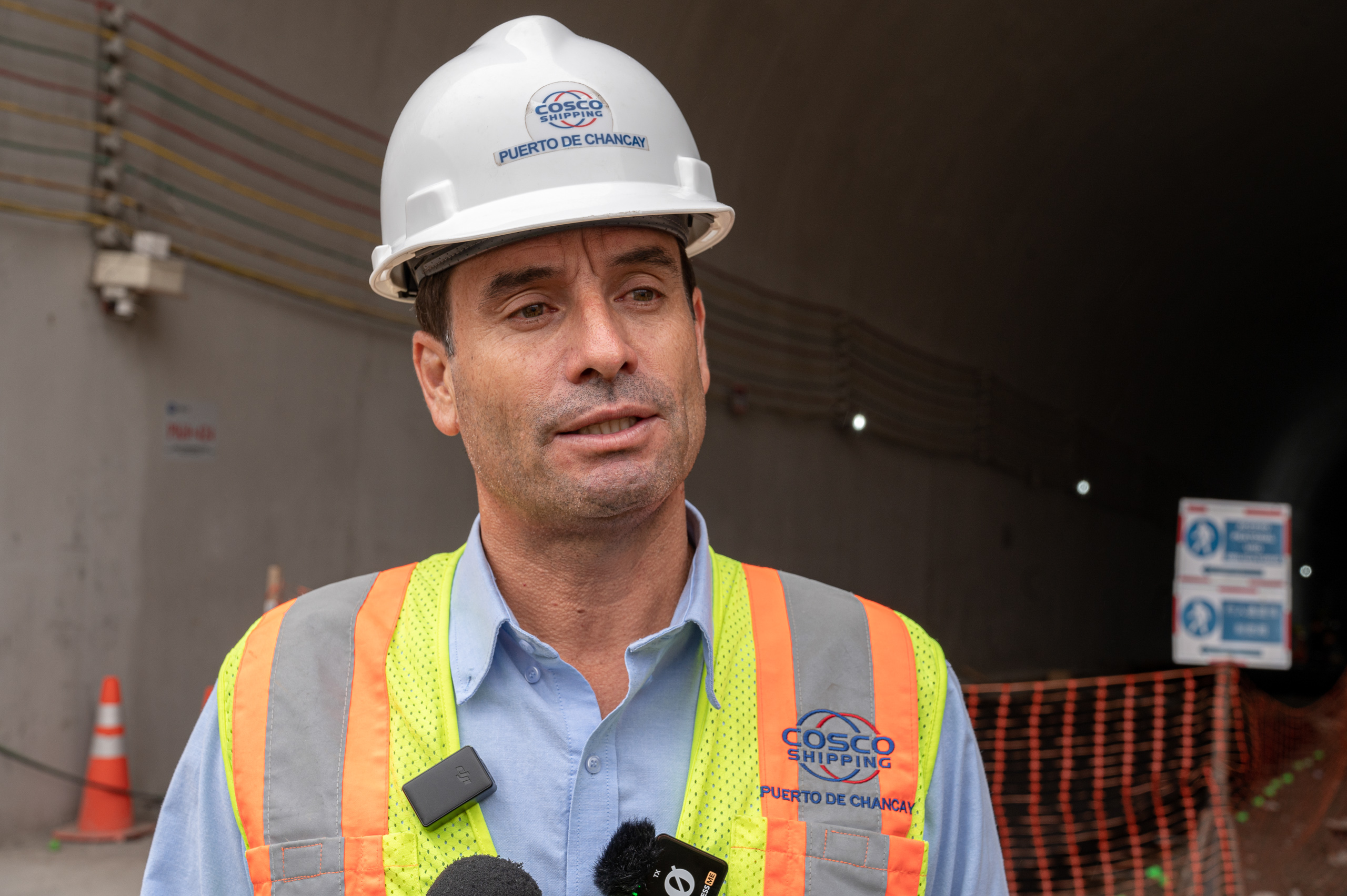 man wearing reflective vest and hard hat