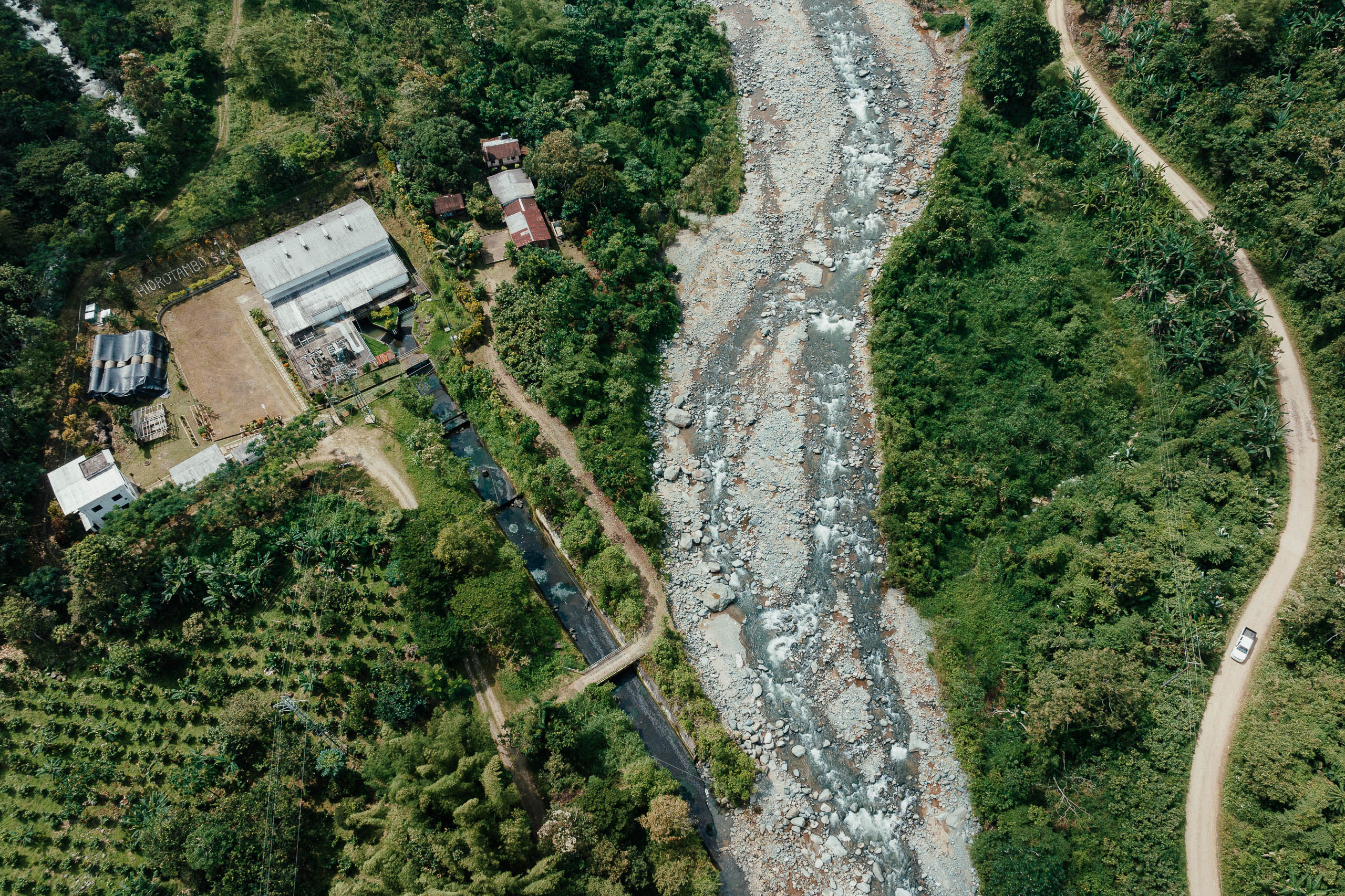 <p>An aerial view of the San José del Tambo hydroelectric plant (left) and the Dulcepamba River in Bolívar province, Ecuador (Image: Misha Vallejo Prut)</p>