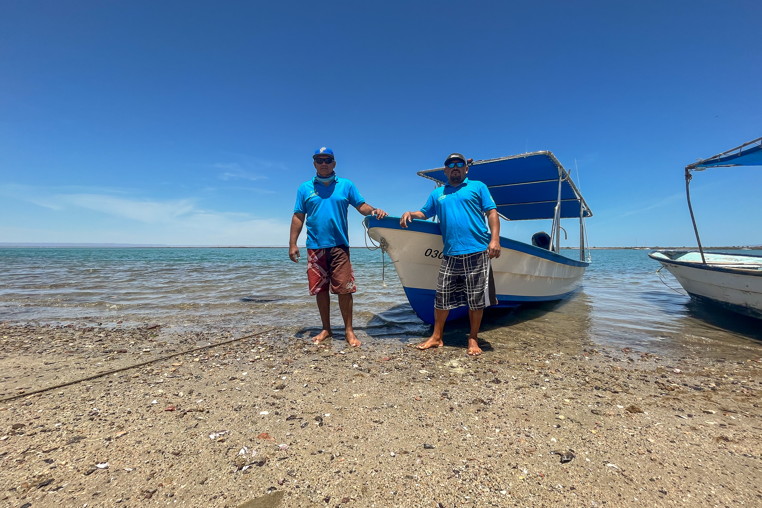 <p>Hubert Mendez (left) with another member of the ‘callo de hacha’ restoration team, in the Bay of La Paz, Mexico (Image: Andrés M. Estrada)</p>