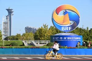 people riding bikes in front of BRF sign