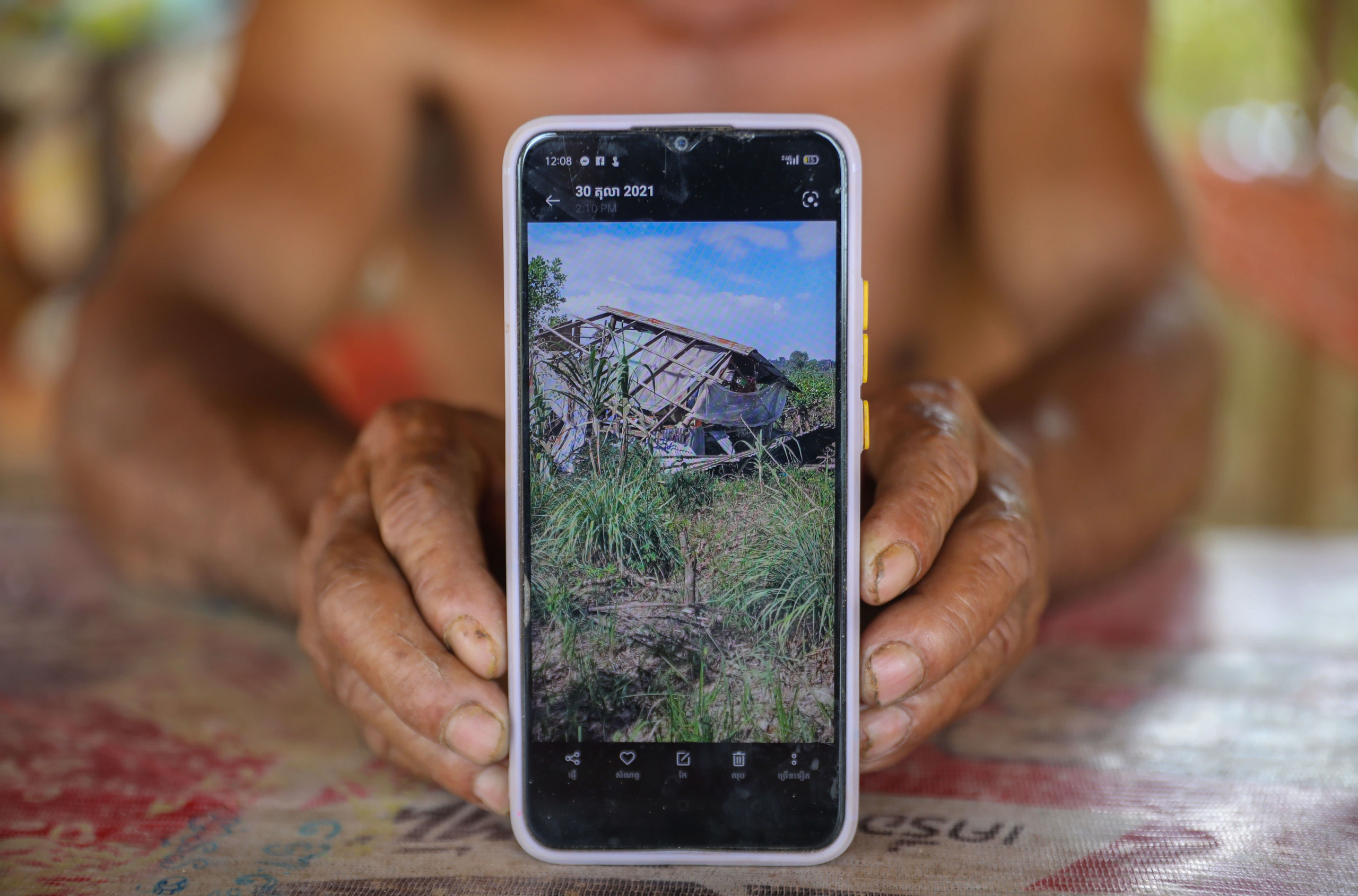 Two hands holding a smartphone, screen facing the camera