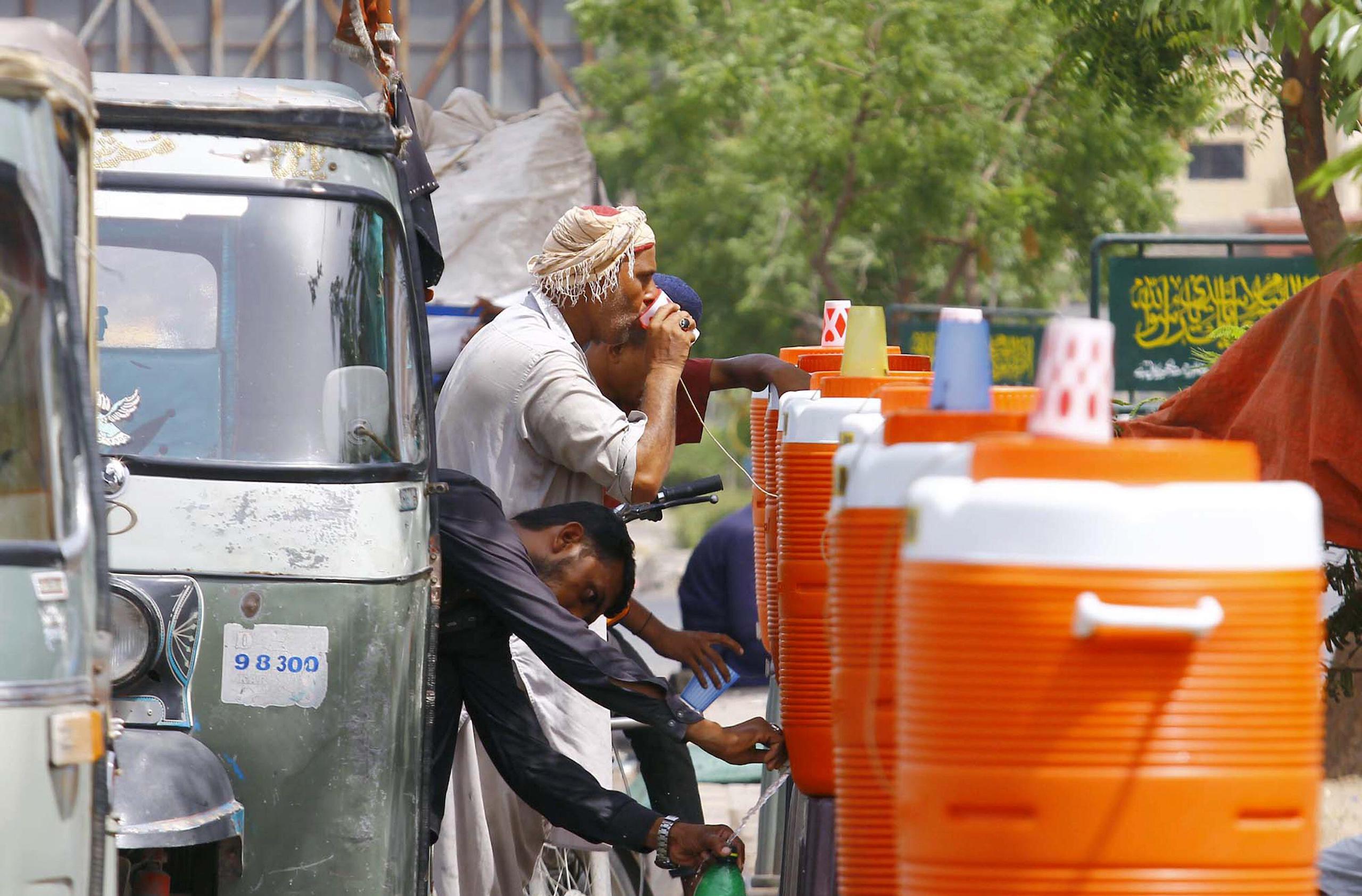Man drinking water from a cup