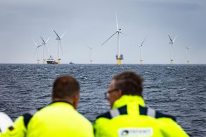 <p>The Hollandse Kust Zuid wind farm in the North Sea. By displacing fossil fuel use, renewable energy generation at sea is a major ocean-based way to lower greenhouse gas emissions. (Image: Jeffrey Groeneweg / Alamy)</p>