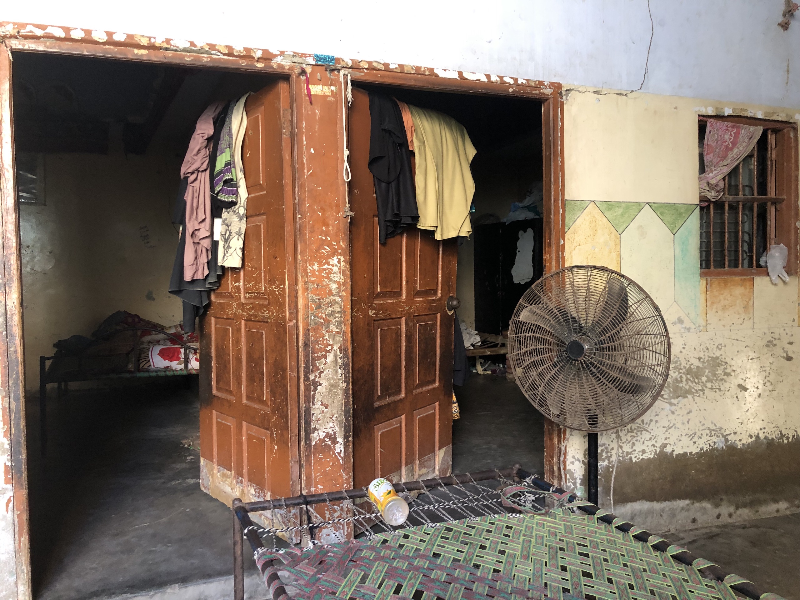 Room with a fan and two doorways