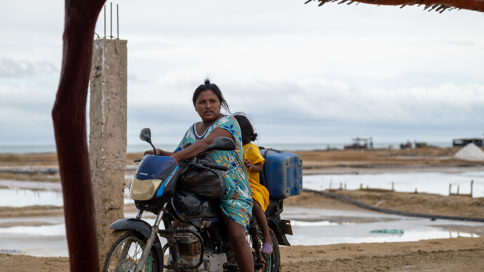 A woman and child on a motorcycle