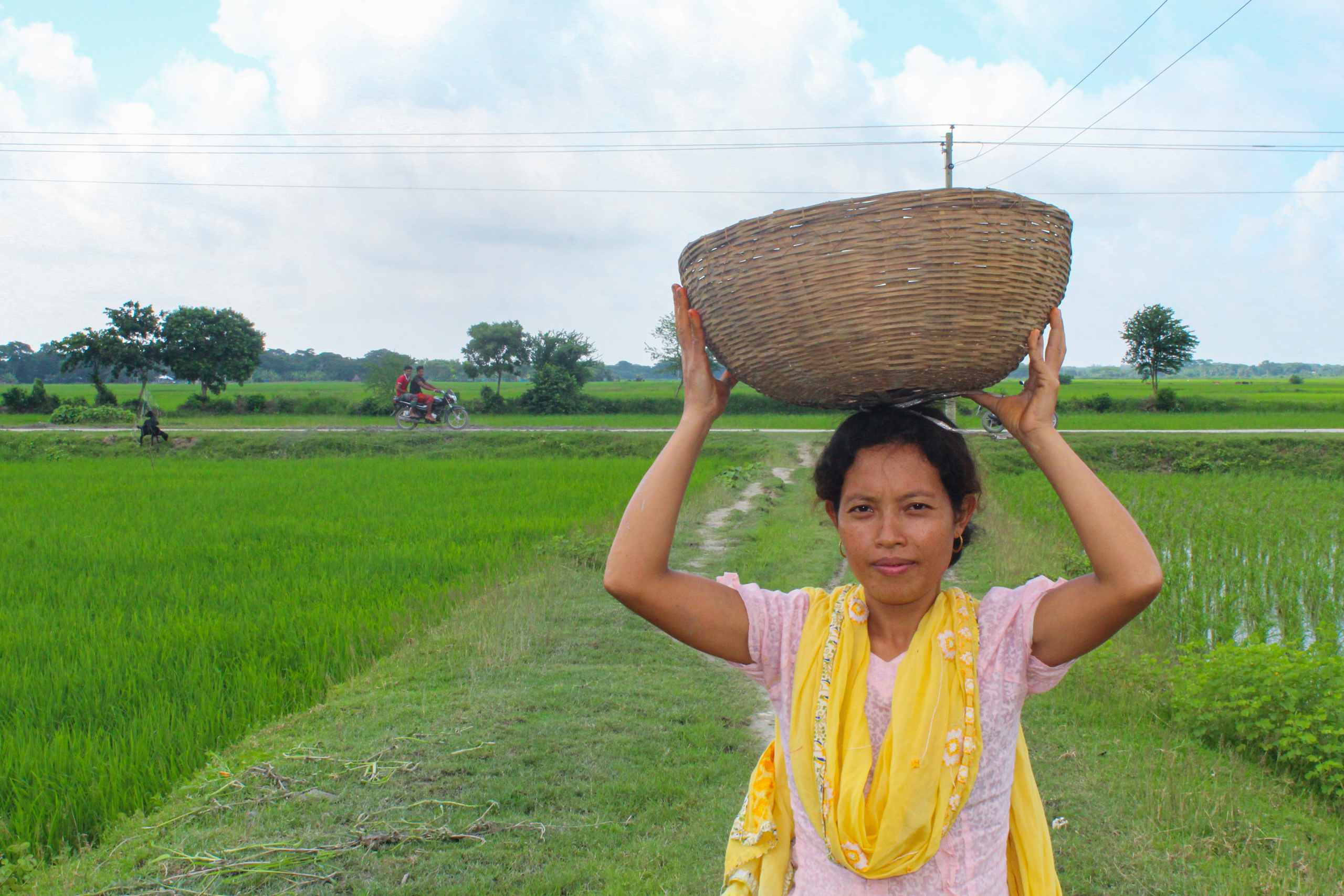 woman carrying basket on head