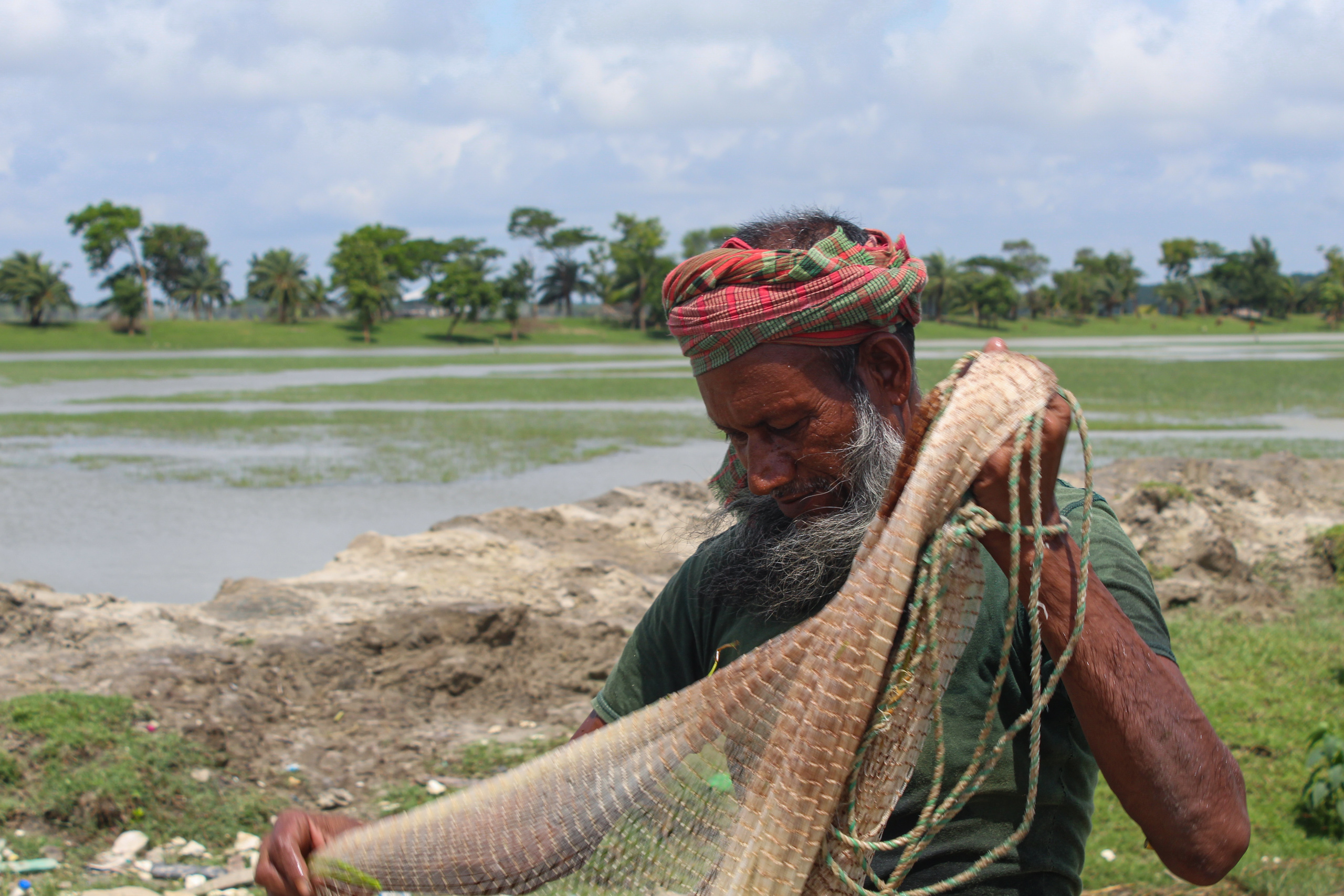 man holding fishing net